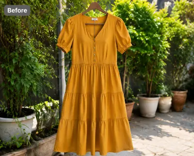 Mustard tiered dress on a hanger